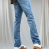 Non strech Raw wash straight fit light blue jean. Left side knee raffu